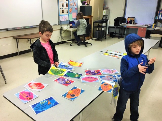 Two Houlton Health and Wellness students make "Brain Break" activities for classroom teachers.