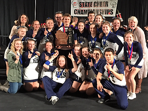 Cheer and stunt team pose with 2016 State Championship trophy.