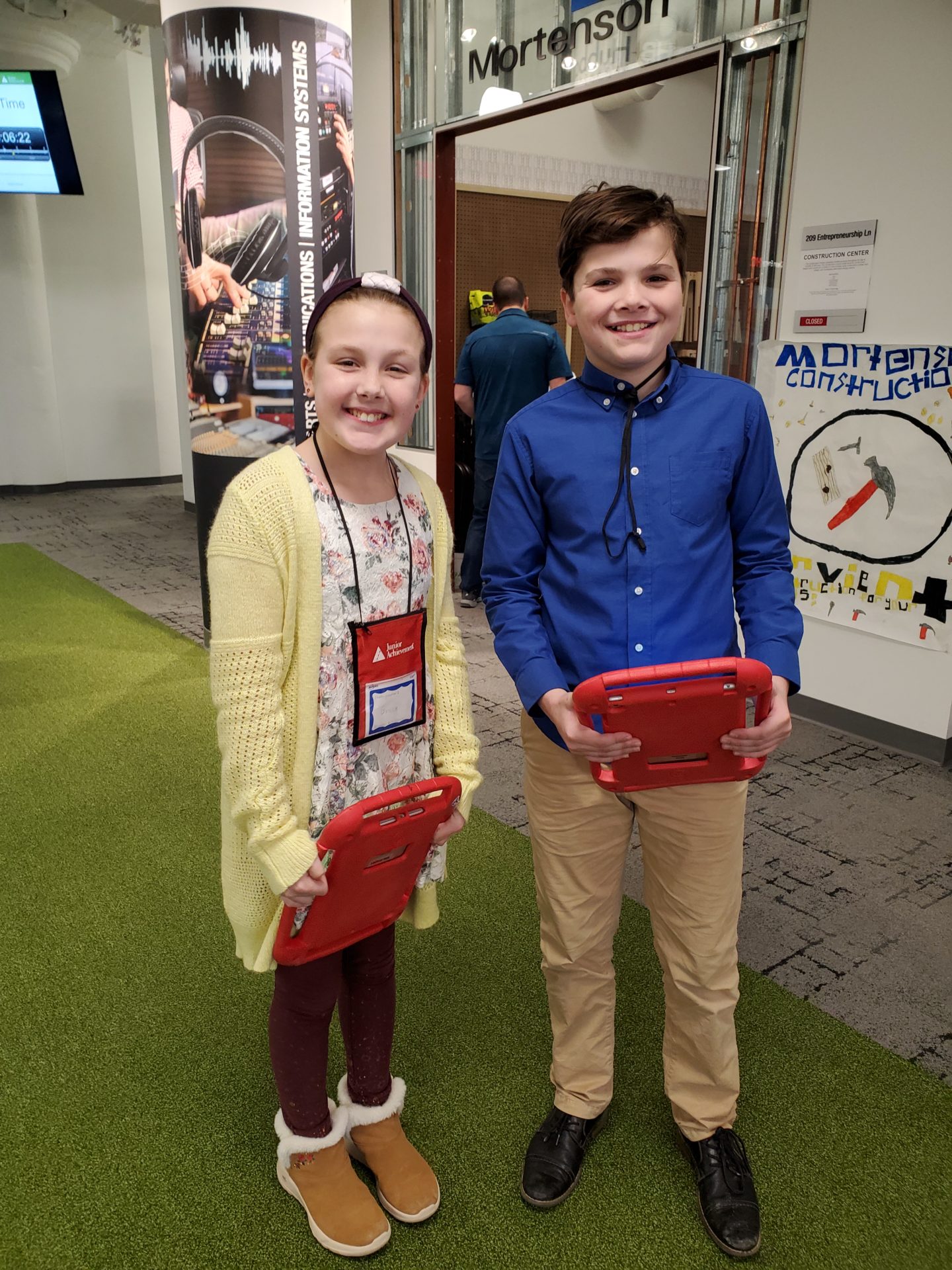 Two students standing in the BizTown center.