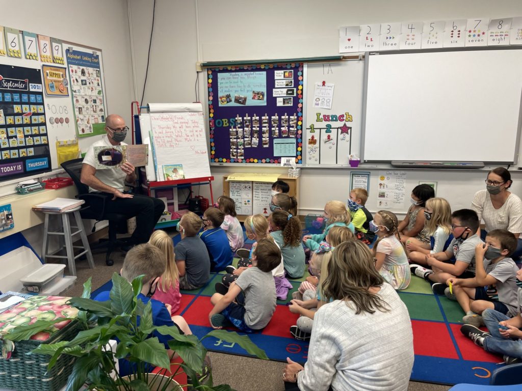 Mr. Schmidt reading "Mr. Potato Head Across America" to Mrs. Andracek's first grade class at E.P. Rock.