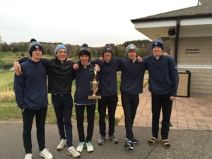 Picture of boys golfers with trophy