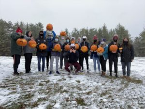 DECA students holding pumpkins