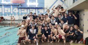 Picture of swim team after winning the conference.