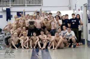 Picture of swim team after winning the sectionals.